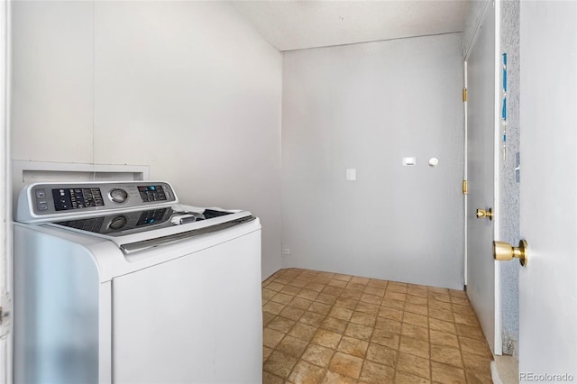 4528 Andes St, Denver, CO 80249 - laundry room featuring washer / dryer and light stone finish flooring