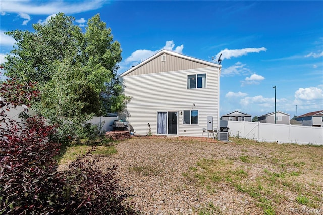 4528 Andes St, Denver, CO 80249 - rear view of property with a fenced backyard and central air condition unit