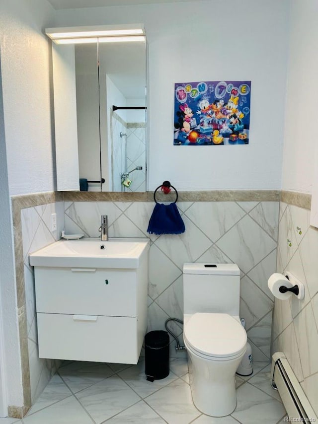 full bath featuring a shower, marble finish floor, a baseboard radiator, toilet, and vanity