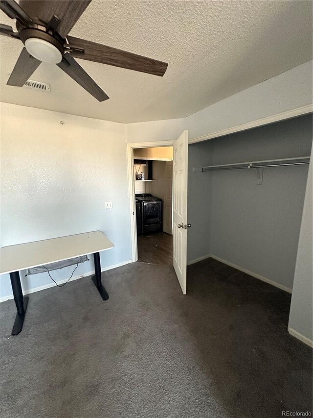 5255 Memphis St Unit 121, Denver, CO 80239 - unfurnished bedroom with washer / clothes dryer, dark colored carpet, baseboards, a textured ceiling, and a ceiling fan