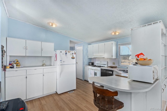 kitchen with white appliances, white cabinets, light hardwood / wood-style flooring, a textured ceiling, and kitchen peninsula