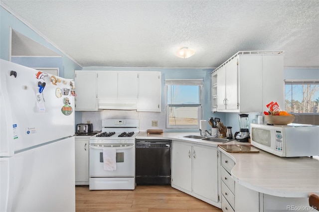 kitchen with white cabinetry, sink, light hardwood / wood-style flooring, ventilation hood, and white appliances