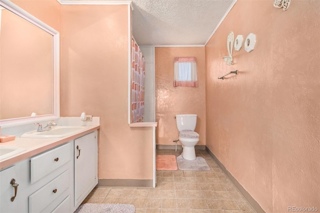 bathroom with vanity, ornamental molding, a textured ceiling, and toilet