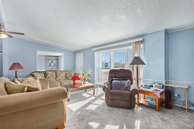 carpeted living room featuring ceiling fan, a textured ceiling, and vaulted ceiling