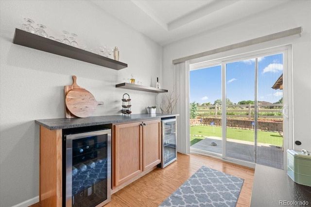 5100 Eaglewood Ln, Johnstown, CO 80534 - indoor dry bar with wine cooler and light wood finished floors