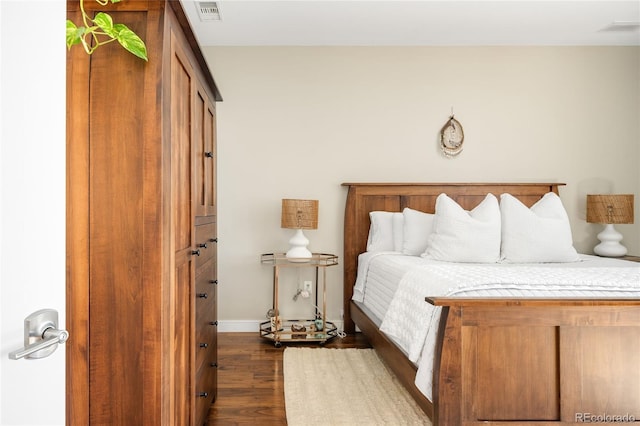 4200 W 17th Ave Unit 611, Denver, CO 80204 - bedroom with dark wood-style floors