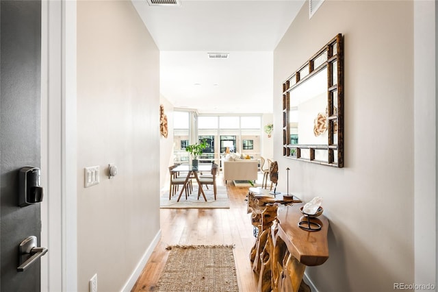 4200 W 17th Ave Unit 611, Denver, CO 80204 - corridor featuring wood finished floors and baseboards