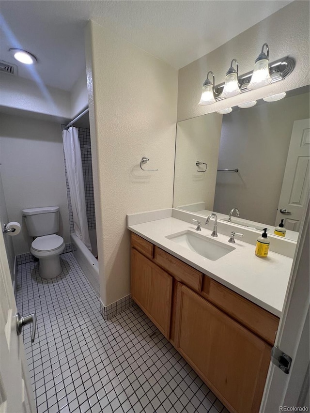 bathroom with tile patterned floors, toilet, vanity, and a shower with shower curtain