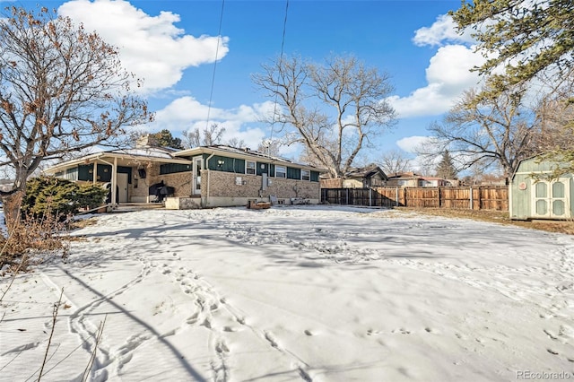 view of snow covered house