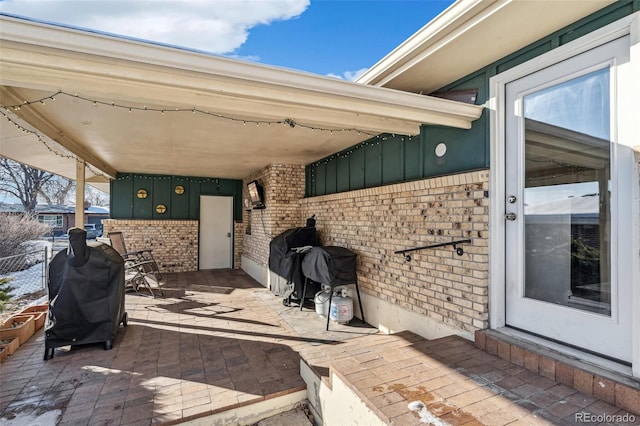 view of patio with a grill