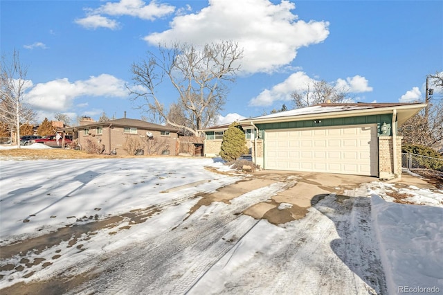 ranch-style house featuring a garage