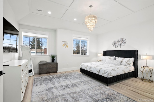 bedroom with recessed lighting, visible vents, light wood-style floors, coffered ceiling, and baseboards