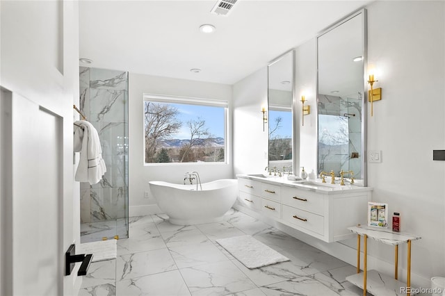 bathroom with marble finish floor, a marble finish shower, a soaking tub, visible vents, and vanity