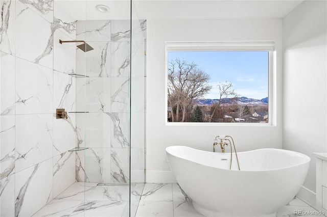 full bathroom featuring a freestanding tub, marble finish floor, and a marble finish shower