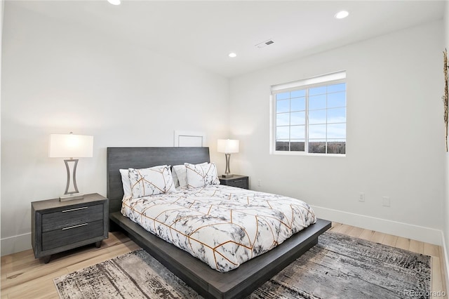 bedroom featuring recessed lighting, baseboards, visible vents, and light wood finished floors