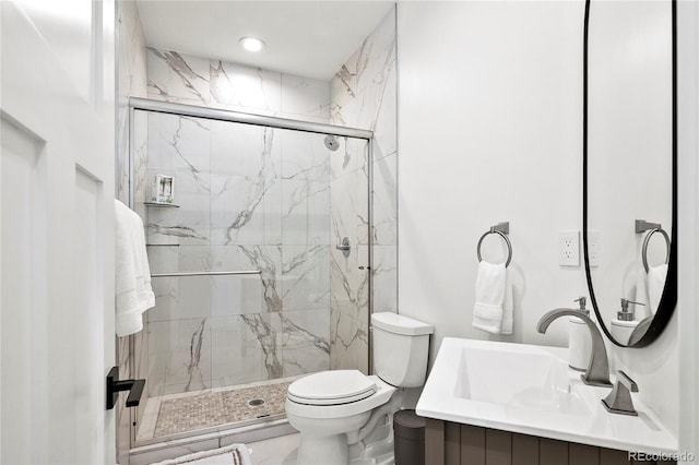 full bath with toilet, vanity, and a marble finish shower