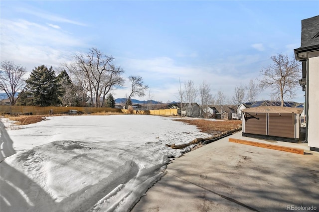 view of yard featuring fence and a patio