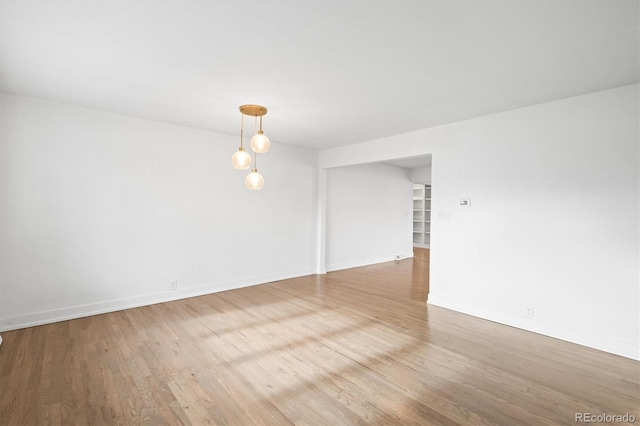 spare room with light hardwood / wood-style flooring