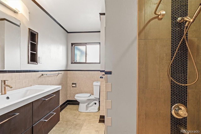 bathroom featuring vanity, tile patterned floors, toilet, tile walls, and walk in shower