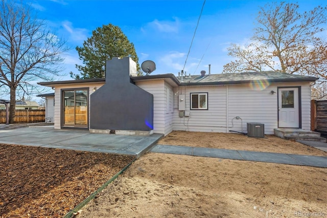 back of property featuring a patio and cooling unit