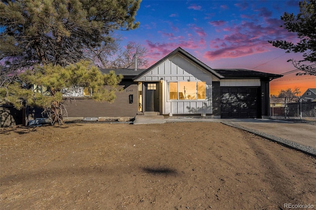 modern inspired farmhouse with a garage