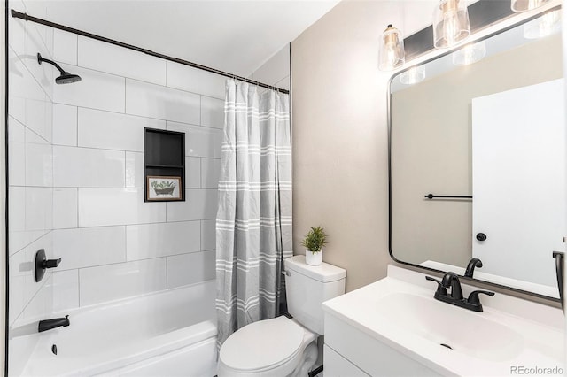 full bathroom featuring vanity, toilet, and shower / bathtub combination with curtain