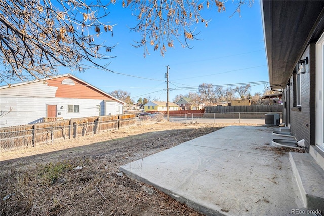 view of yard featuring cooling unit and a patio area