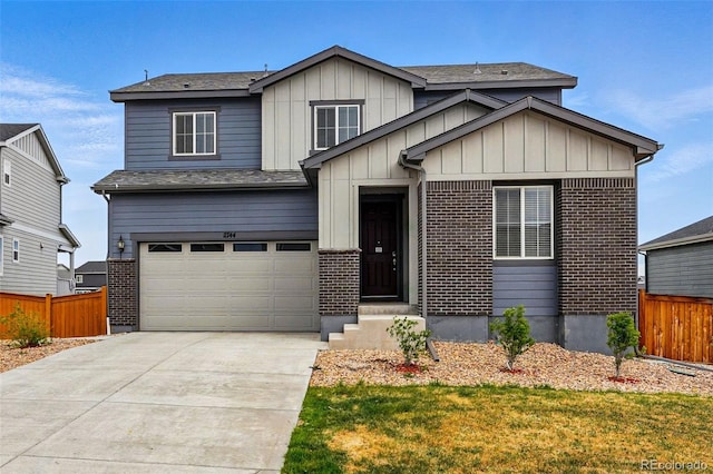 11744 Magnolia Dr, Thornton, CO 80233 - view of front facade with concrete driveway, a garage, board and batten siding, and brick siding