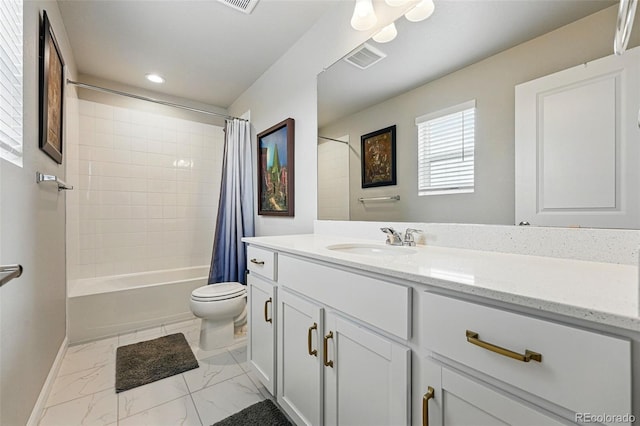 11744 Magnolia Dr, Thornton, CO 80233 - bathroom featuring vanity, toilet, shower / bath combo with shower curtain, baseboards, and marble look tiles