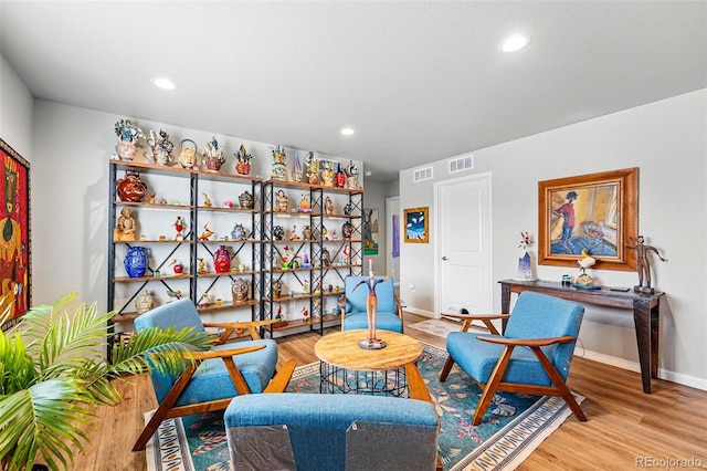 11744 Magnolia Dr, Thornton, CO 80233 - sitting room featuring baseboards, wood finished floors, and recessed lighting