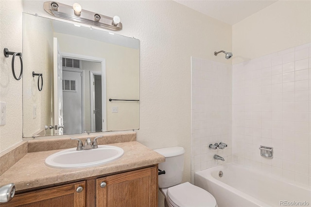 full bathroom with vanity, shower / bath combination, and toilet