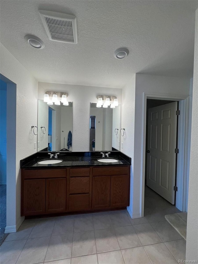 bathroom featuring tile patterned floors and vanity