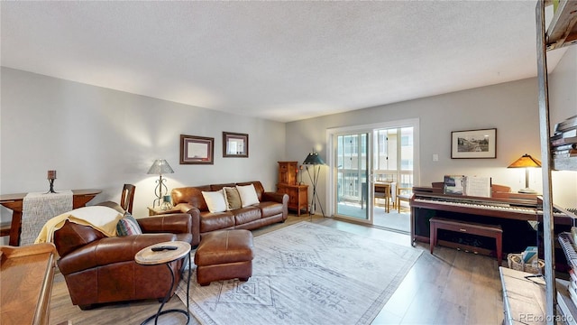 13626 E Bates Ave Unit 302, Aurora, CO 80014 - living room with wood finished floors and a textured ceiling