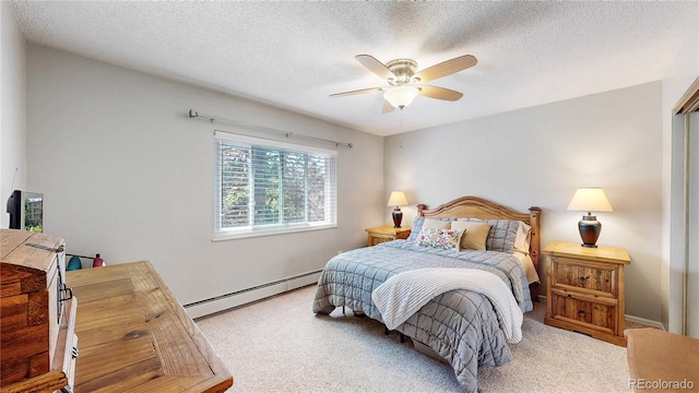 13626 E Bates Ave Unit 302, Aurora, CO 80014 - bedroom featuring a baseboard radiator, carpet, a textured ceiling, and a ceiling fan