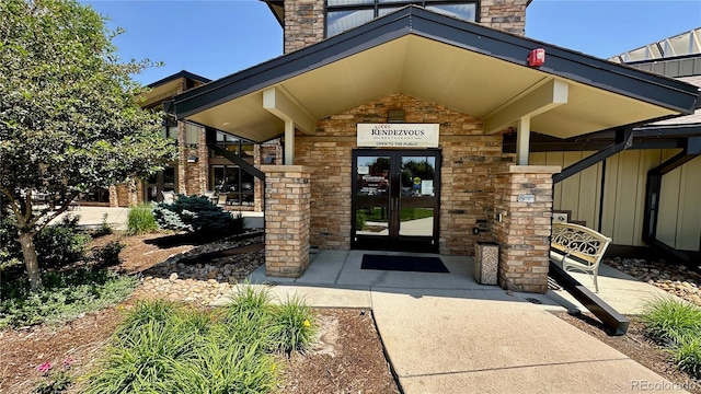 13626 E Bates Ave Unit 302, Aurora, CO 80014 - property entrance featuring french doors and stone siding