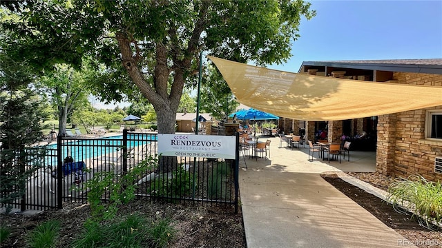 13626 E Bates Ave Unit 302, Aurora, CO 80014 - surrounding community featuring a patio area and a pool