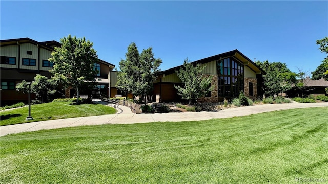 13626 E Bates Ave Unit 302, Aurora, CO 80014 - view of front of property featuring a front yard and brick siding