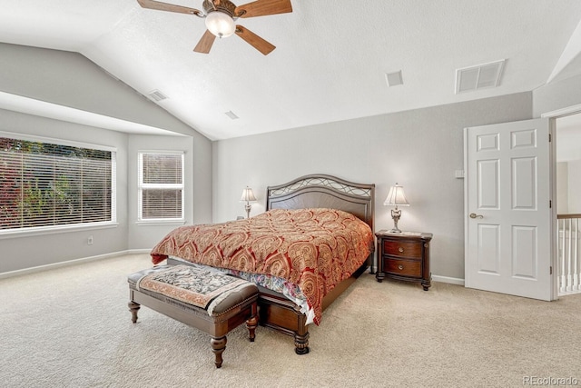 carpeted bedroom with ceiling fan and lofted ceiling