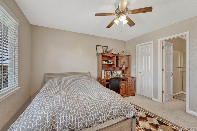 bedroom featuring light carpet and ceiling fan