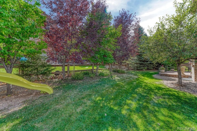 view of yard featuring a playground