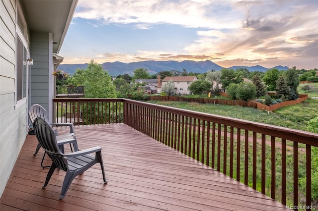 6245 Fencerail Hts, Colorado Springs, CO 80919 - wooden terrace featuring a mountain view and a fenced backyard