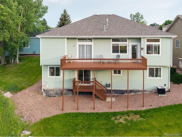 6245 Fencerail Hts, Colorado Springs, CO 80919 - rear view of property with a deck, a lawn, and a shingled roof