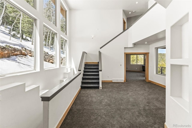 10508 Christopher Dr, Conifer, CO 80433 - stairway featuring carpet flooring, a towering ceiling, and recessed lighting