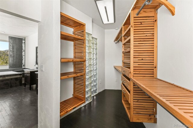 10508 Christopher Dr, Conifer, CO 80433 - walk in closet featuring wood finished floors