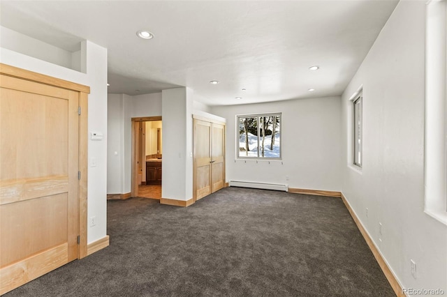 10508 Christopher Dr, Conifer, CO 80433 - unfurnished bedroom featuring dark colored carpet, a baseboard heating unit, and recessed lighting