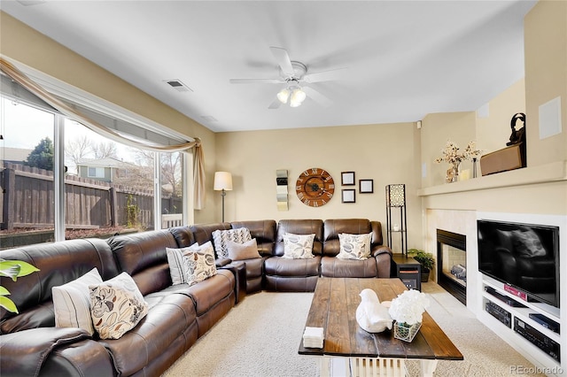19447 E Bellisario Creek Dr, Parker, CO 80134 - carpeted living room featuring ceiling fan and a fireplace with flush hearth