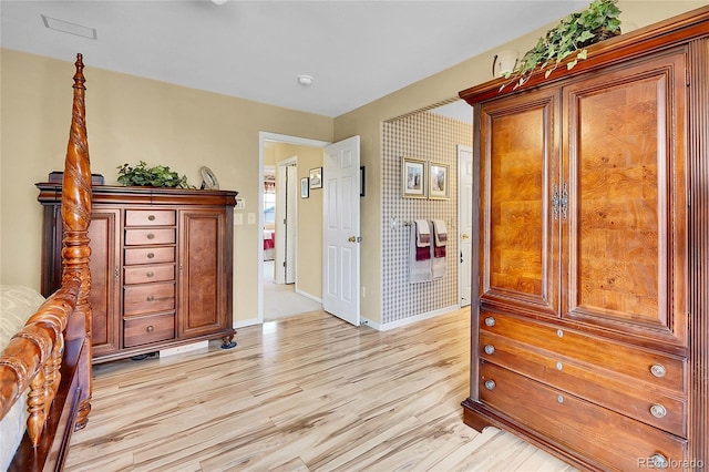 19447 E Bellisario Creek Dr, Parker, CO 80134 - bedroom with light wood finished floors and baseboards