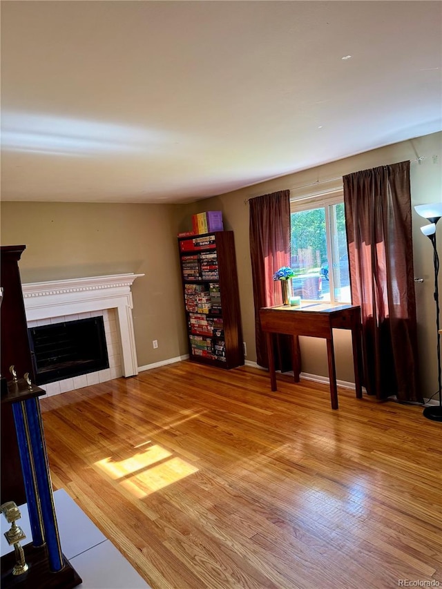 6616 S Lincoln St, Centennial, CO 80121 - living room featuring a tile fireplace and wood finished floors