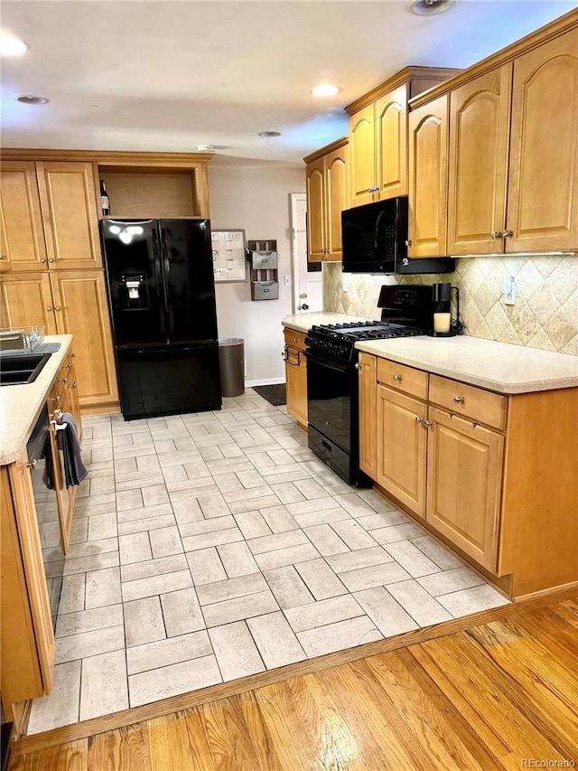 6616 S Lincoln St, Centennial, CO 80121 - kitchen with black appliances, light countertops, tasteful backsplash, and recessed lighting