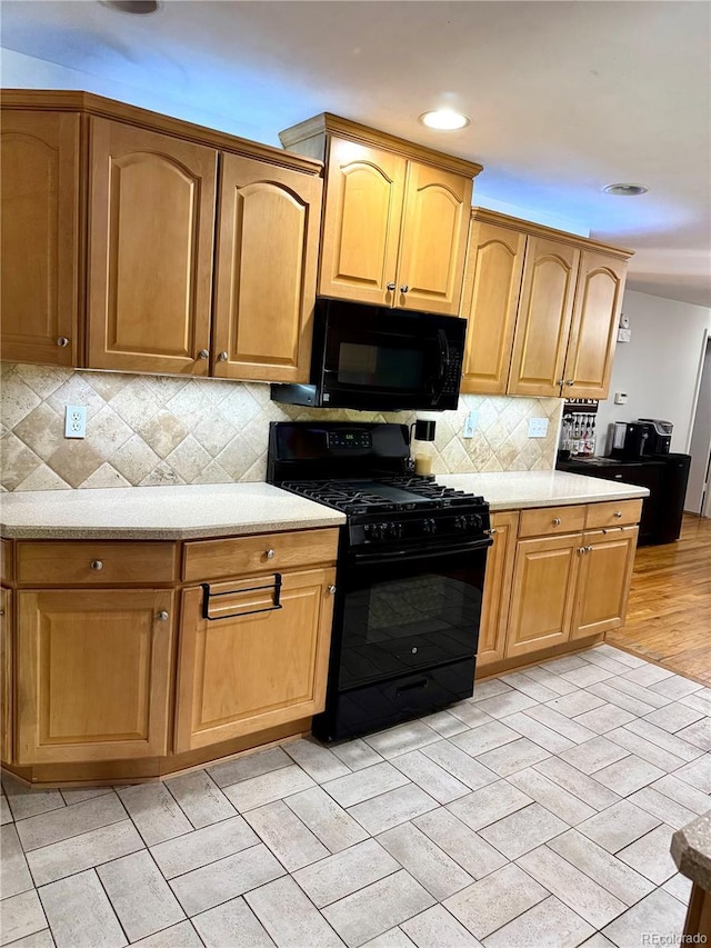 6616 S Lincoln St, Centennial, CO 80121 - kitchen featuring black appliances, light countertops, backsplash, and recessed lighting